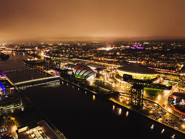 Glasgow Scotland: 26th Nov 2025: Protest projection highlights Indian flag on the Glasgow Armadillo during evening demonstration drone view of Glasgow at night