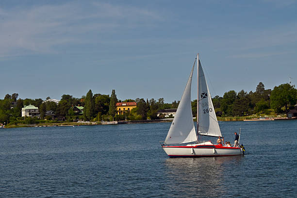 Sailboat on sea and rocky coastline, Lysekil, Västra Götaland County, Gullmarn fjord
