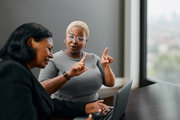 istock Business Collaboration Between Two Professional Women Working Together Indoors 2249159550