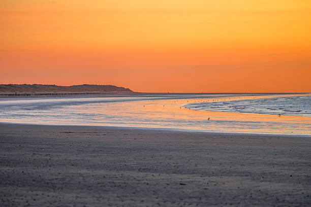 Bright sunset at the sea on the coast near Calais.
