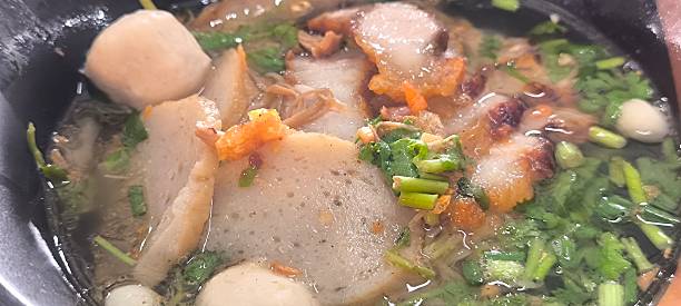 istock Noodle soup in a ceramic bowl on a wooden table 2249164802