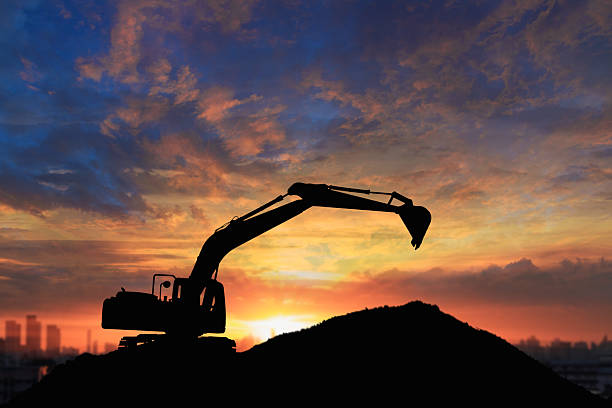 istock Crawler excavators silhouette are digging the soil . 2249166791