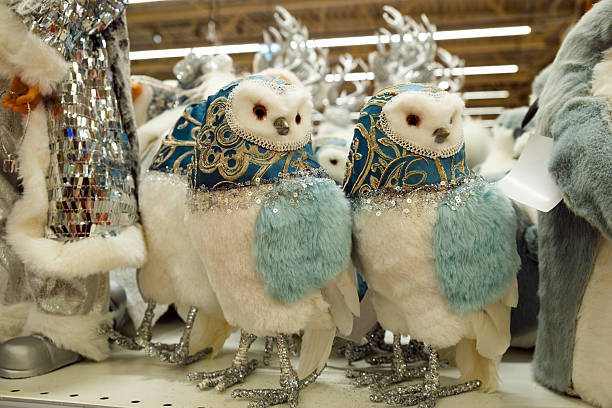 istock Decorative Christmas plush owls on store counter. 2249167292