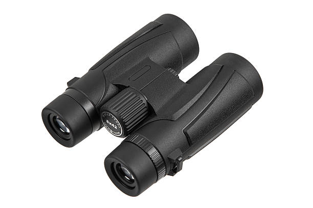 Black compact binoculars with textured grip, isolated and angled on a white background.