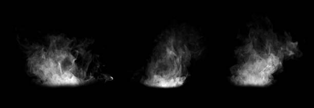 istock White smoke clouds rising on a black background, creating a realistic fog and vapor effect ideal for overlays, visual effects, design elements, and atmospheric digital artwork compositions. 2249173205