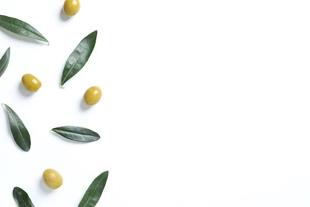 istock Olives and leaves on white  background 2249175250