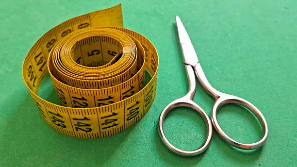 istock Sewing tape measure and scissors 2249175318