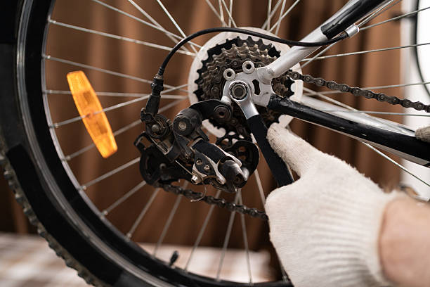 istock mechanic's hands using a wrench to work repairing bicycle at home 2249176665