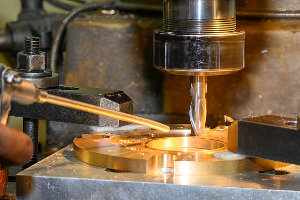 istock The hole boring  process on NC milling machine by flat nose end mill tool with brass ring parts. 2249177315