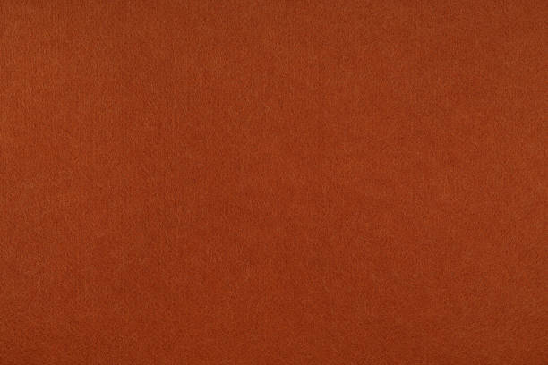 istock Brown felt background - close-up of a soft fabric surface. Seamless background, graphic design, scrapbooking, textile layouts, creative projects. 2249177422