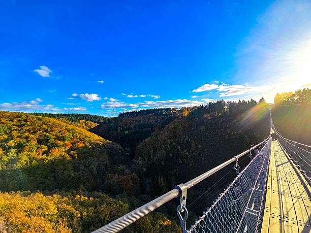 istock Autumn Crossing suspensionbridge autumn thrilling 2249178003