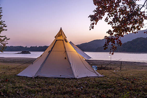 istock Autumn forest camping, a campfire at night, and the sky. 2249183975