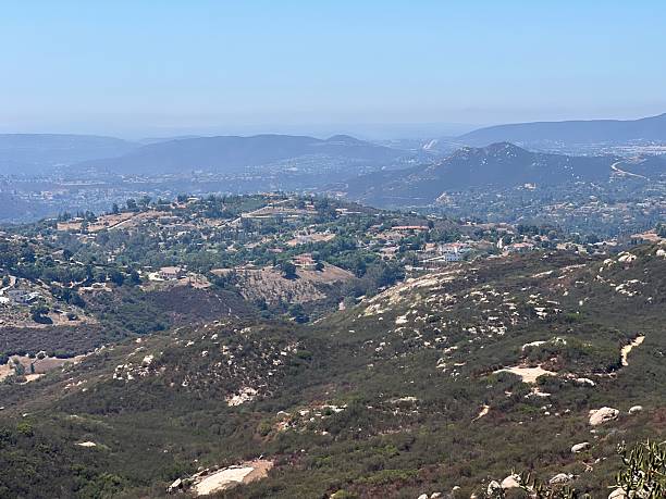 istock Scenic View of Rolling Hills and Valleys Under a Clear Blue Sky at Midday 2249184490