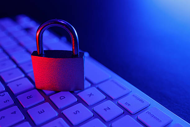 istock Cyber security illustrated with a padlock on a keyboard in a dimly lit environment 2249187279