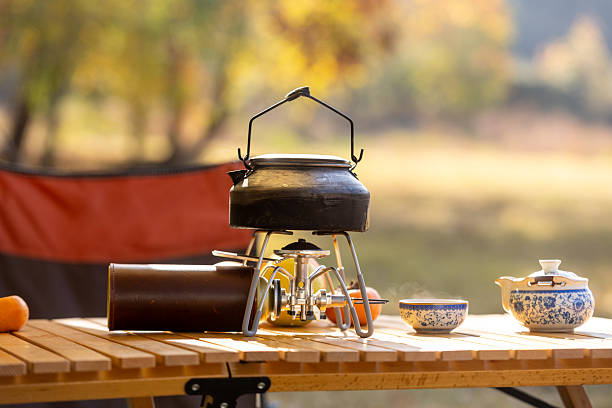 istock Outdoor camping, using a gas stove to boil water. 2249187346