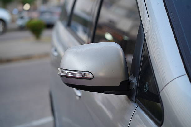 istock Close-Up of a Silver Car Side Mirror Capturing Reflections on a Sunny Day in an Urban Setting with Soft Background Blurs and Interesting Details 2249189834
