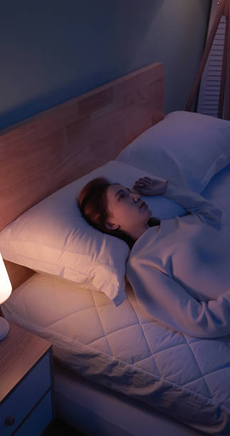 istock woman wakes up startled by nightmare 2249191695
