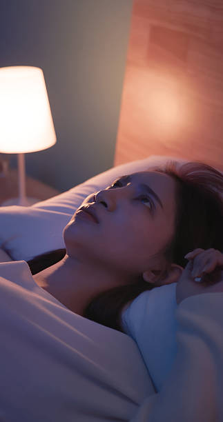 istock woman wakes up startled by nightmare 2249191710