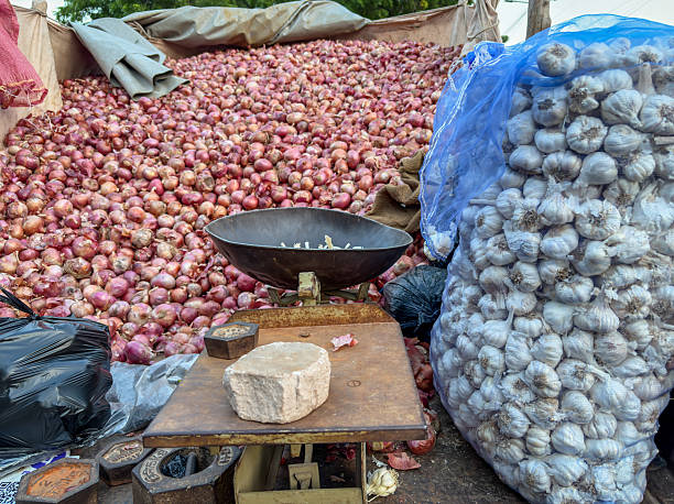 istock fresh red onions stacked in bulk at vegetable market 2249192218