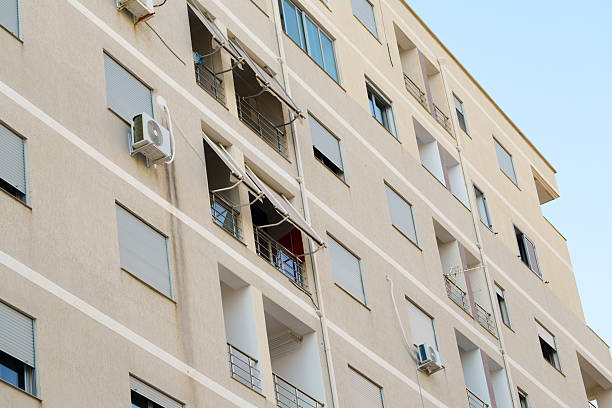 istock Modern Mediterranean-style apartment building with clean white facades. Ideal for apartment rental, real-estate purchase, relocation to Albania, or coastal living promoted by housing agencies. 2249201927
