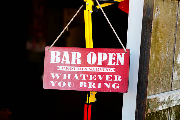 Red open sign of small bar at door