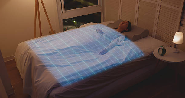 istock Woman sleeping with smart bed monitoring system 2249204571