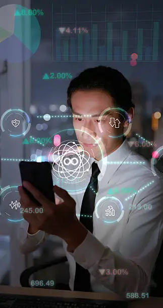 Photo of Businessman using smartphone with quantum technology interface