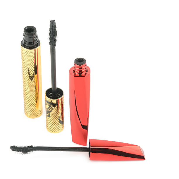 Red mascara smudge with mascara wand on a white background.