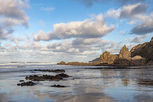 istock Winter sunrise light and shadows on Cornish beach 2249207595