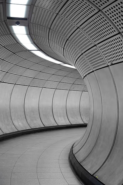 istock Curved modern subway tunnel design in London 2249208778