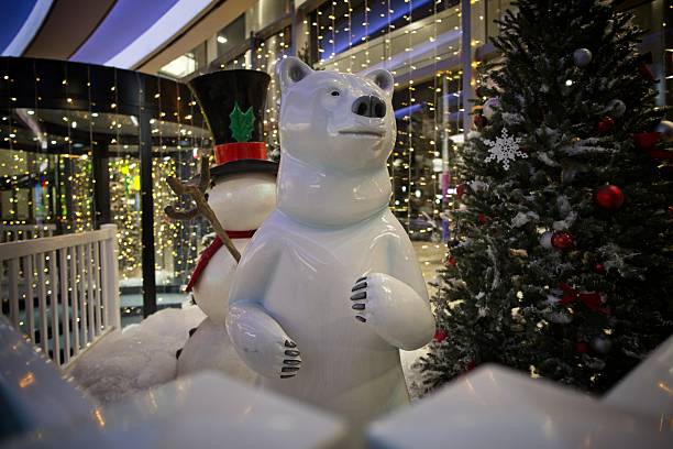 Festive mall display with polar bear and snowman decorations.
