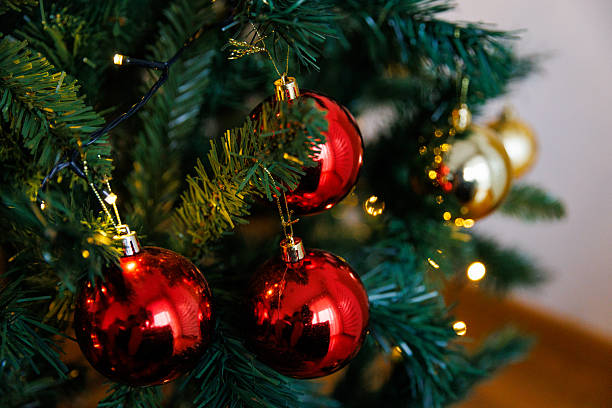 istock Red and gold ornaments on Christmas tree 2249217538