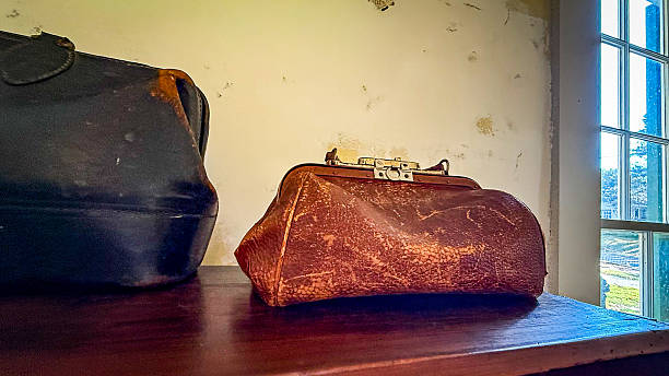 istock Vintage leather doctors bags on a shelf 2249219169