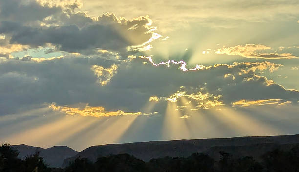 istock Sunbeam rays and clouds at sunset over Virgin Utah 2249220187