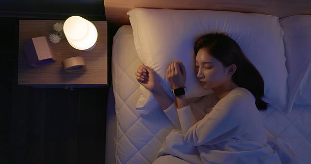 istock asian woman sleep with smartwatch 2249220670