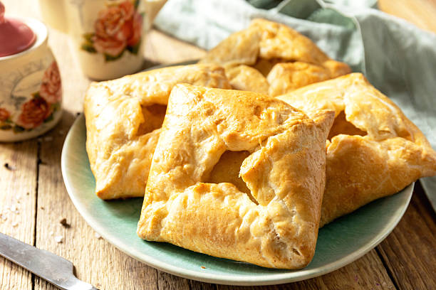 istock Puff pastry patties with mushroom and cheese filling on a rustic background. 2249222988