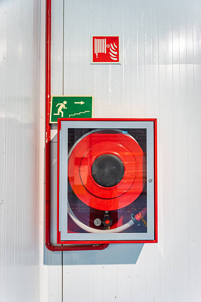 istock A red fire hydrant box is mounted on a wall, part of a building's fire safety system 2249223756