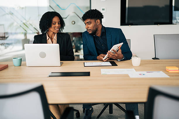 istock Business colleagues collaborating on project in modern office 2249231897