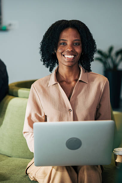 istock Smiling young adult black woman using laptop 2249232044