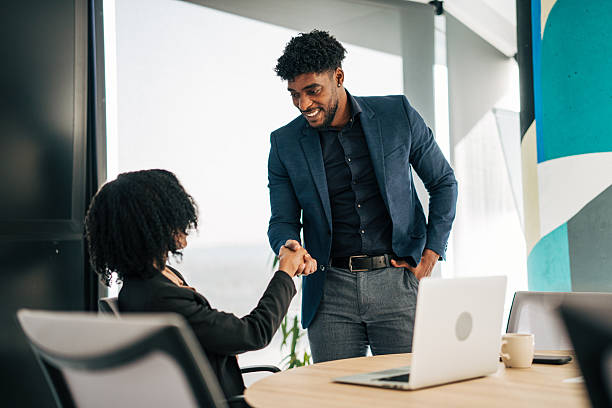 istock Colleagues shaking hands closing a business deal 2249232153