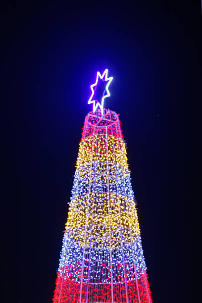 istock Colorful Christmas tree lights with star topper 2249232278