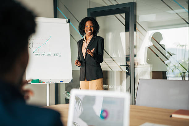 istock Businesswoman giving presentation on growth chart in office 2249232333