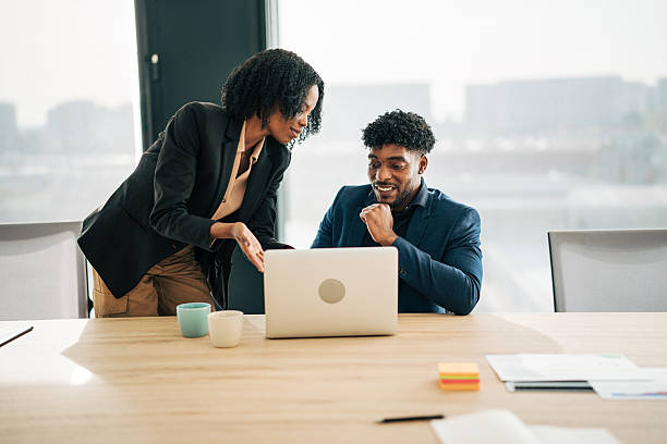 istock Business colleagues collaborating on laptop in modern office 2249232532