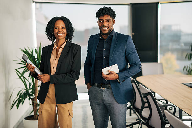 istock Diverse business professionals smiling in modern office 2249232639