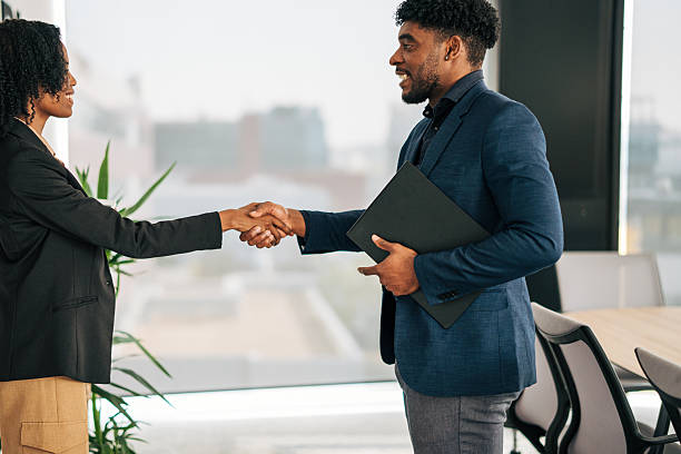 istock Business people shaking hands celebrating agreement 2249232681