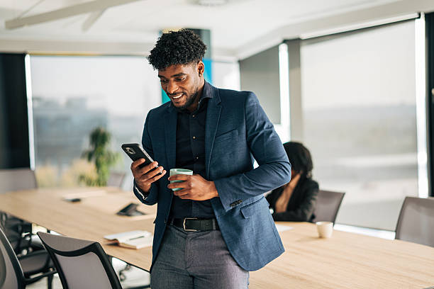 istock Professional businessman browsing smartphone during office coffee break 2249232735