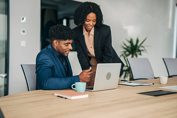 istock Diverse business people collaborating on laptop in a modern office 2249232762