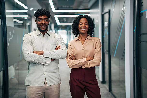 istock Diverse business professionals standing in modern office corridor 2249232921