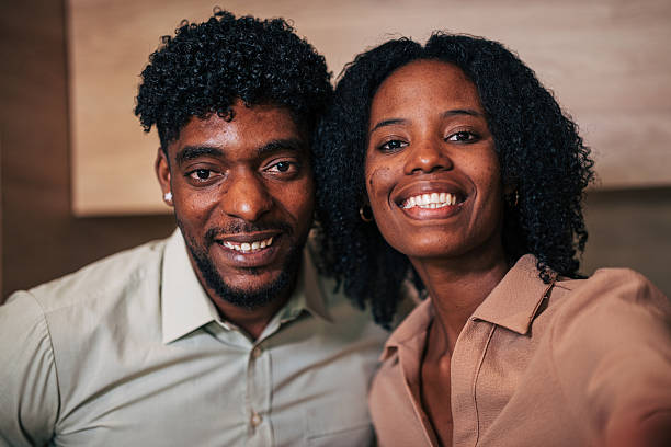 istock Happy smiling black couple looking at camera 2249233778