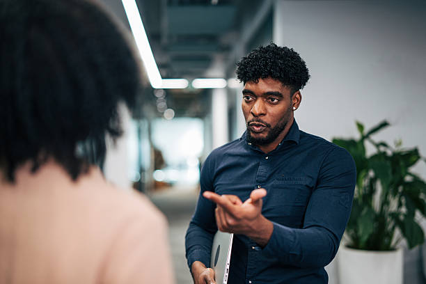 istock Black business colleagues having serious discussion in office 2249234243